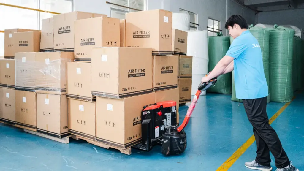 worker carries air filter goods