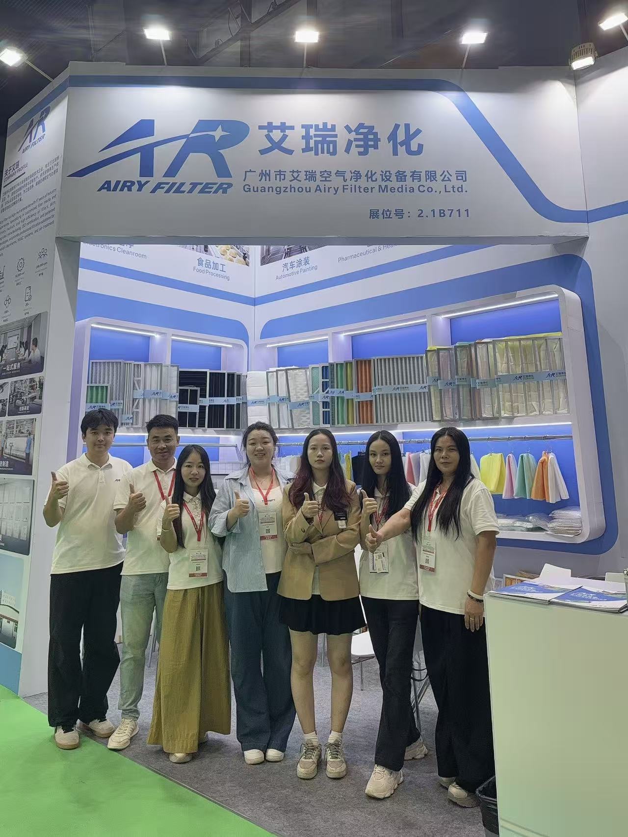 The AIRY AIR FILTER team in front of the booth at the end of the exhibition