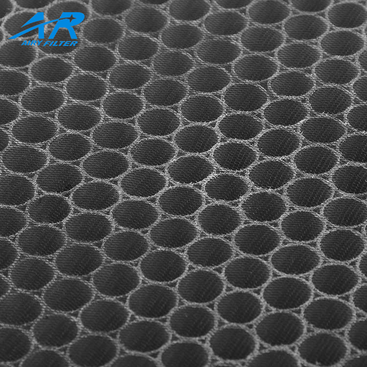 Close-up of hexagonal support mesh on filter media